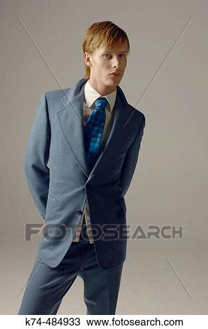 young man wearing a suit and tie View Large Photo Image Stock Image - young man wearing a suit and tie. Fotosearch