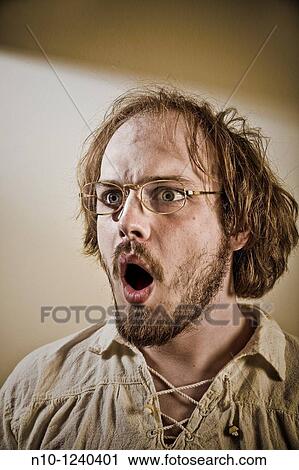 Young man wearing glasses View Large Photo Image Stock Image - Young man wearing glasses. Fotosearch