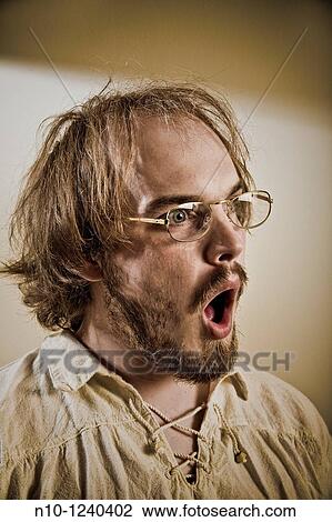 Young man wearing glasses View Large Photo Image Stock Image - Young man wearing glasses. Fotosearch