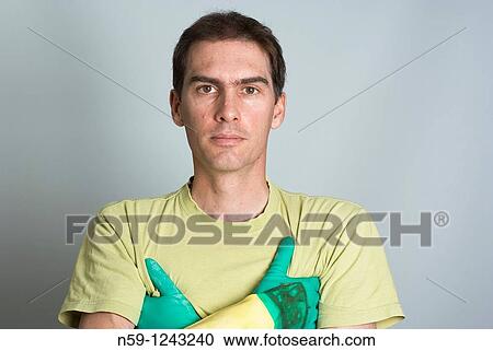 Young man wearing rubber kitchen cleaning gloves. View Large Photo Image Stock Image - Young man wearing rubber kitchen cleaning gloves.. Fotosearch