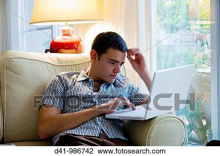 young man with apple laptop computer 2008 View Large Photo Image Stock Image - young man with apple laptop computer 2008. Fotosearch