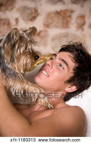 Young man with dog. View Large Photo Image Stock Image - Young man with dog.. Fotosearch
