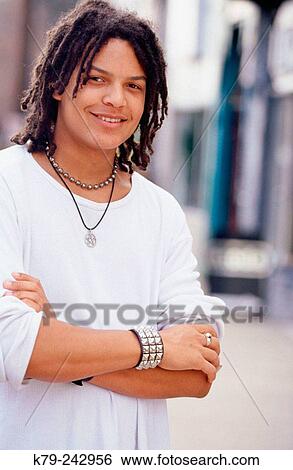 Stock Photograph - young man with dreads. Fotosearch