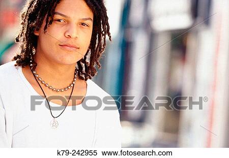Stock Photography - young man with dreads. Fotosearch