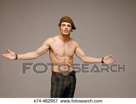 young man with no shirt gesturing to camera View Large Photo Image Stock Photo - young man with no shirt gesturing to camera. Fotosearch