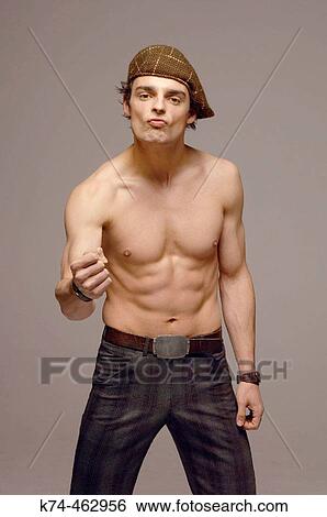Stock Photograph - young man with no shirt gesturing to camera. Fotosearch
