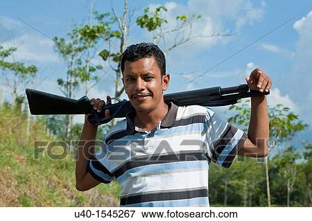 Young man with shotgun View Large Photo Image Stock Photo - Young man with shotgun. Fotosearch