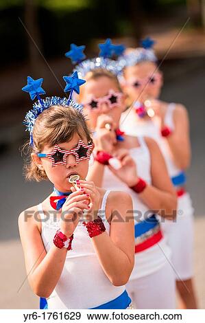 Stock Photo - Young members of Uncle Sam's Band play their kazoo's during the annual I? On Community Independence Day Parade on July 4, 2012 in Mt Pleasant, South Carolina. Fotosearch