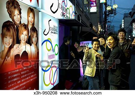 young men joking in the street in front of poster with young women, Gion district, Kyoto, Japan View Large Photo Image Stock Photo - young men joking in the street in front of poster with young women, Gion district, Kyoto, Japan. Fotosearch