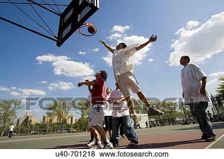 Young men playing basketball View Large Photo Image Stock Photo - Young men playing basketball. Fotosearch