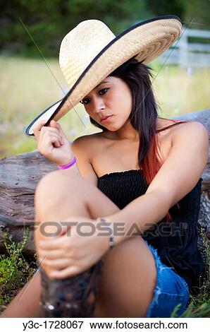 Young mexican woman with hat View Large Photo Image Stock Photo - Young mexican woman with hat. Fotosearch