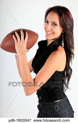 young model posing with a ball at Studio futball View Large Photo Image Stock Photo - young model posing with a ball at Studio futball. Fotosearch