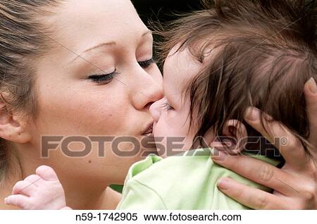 Young mother with 9 week old baby boy View Large Photo Image Stock Photography - Young mother with 9 week old baby boy. Fotosearch