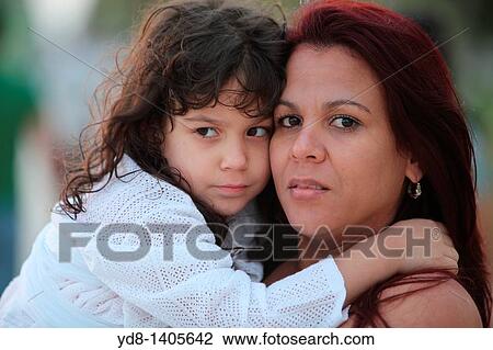 Young mother with her daughter in Miami Beach, Florida, USA View Large Photo Image Stock Image - Young mother with her daughter in Miami Beach, Florida, USA. Fotosearch