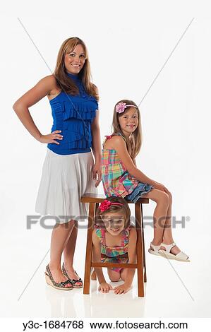 Young mother with her two daughters View Large Photo Image Stock Photo - Young mother with her two daughters. Fotosearch