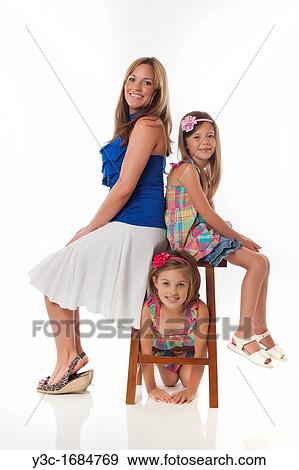 Young mother with her two daughters View Large Photo Image Stock Photo - Young mother with her two daughters. Fotosearch