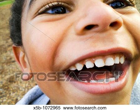 young multiracial boy, laughing joyfully close up, Horizontal View Large Photo Image Stock Photography - young multiracial boy, laughing joyfully close up, Horizontal. Fotosearch