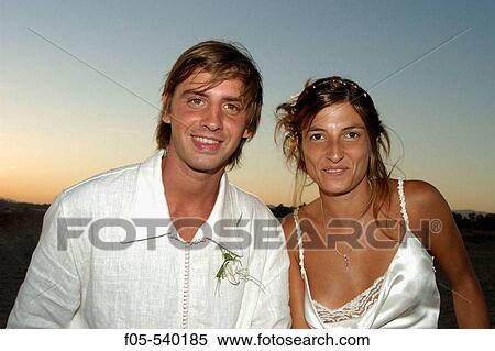 Young newly married couple at sunset. View Large Photo Image Stock Photography - Young newly married couple at sunset.. Fotosearch