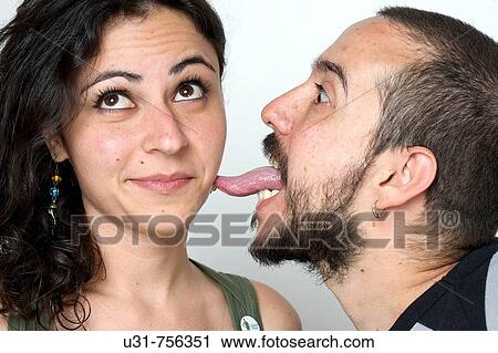Young newlywed husband liking her wife on the cheek View Large Photo Image Stock Image - Young newlywed husband liking her wife on the cheek. Fotosearch
