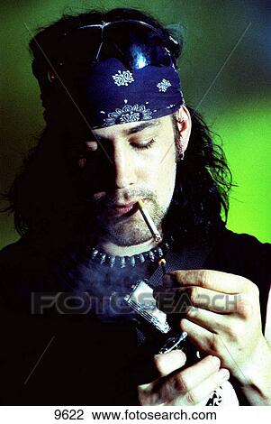 Young NYC bike messenger lighting a cigarette View Large Photo Image Stock Image - Young NYC bike messenger lighting a cigarette. Fotosearch