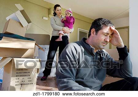 Young parents and their daughter stand beside cardboard boxes outside their home Concept photo illustrating divorce, homelessness, eviction, unemployment, financial, marriage or family issues View Large Photo Image Stock Image - Young parents and their daughter stand beside cardboard boxes outside their home Concept photo illustrating divorce, homelessness, eviction, unemployment, financial, marriage or family issues. Fotosearch