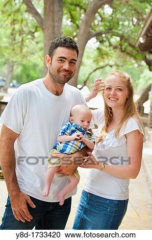 Young parents with their baby boy View Large Photo Image Stock Image - Young parents with their baby boy. Fotosearch