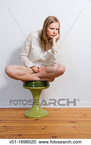 Young pensive woman at home View Large Photo Image Stock Image - Young pensive woman at home. Fotosearch
