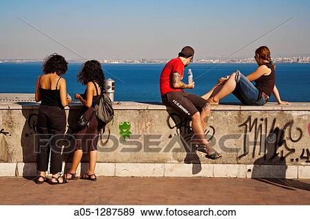 Stock Photo - Young people. Alfama district, Lisbon, Portugal.. Fotosearch
