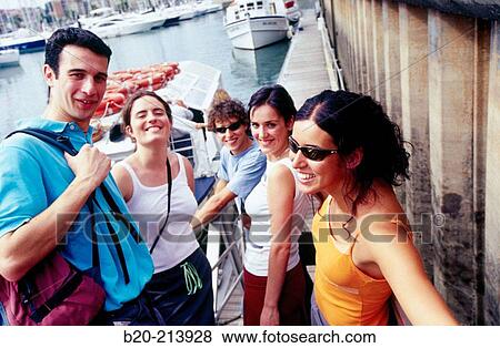 Stock Photo - Young people at Hendaye harbor. France. Fotosearch