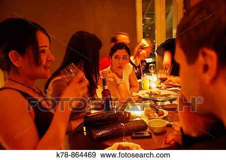 Stock Photo - young people at the upmarket The House Cafe restaurant in the Ortakoy area Istanbul, Turkey. Fotosearch