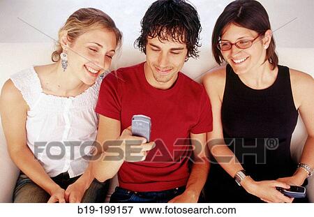 Young people, cell phone View Large Photo Image Stock Photo - Young people, cell phone. Fotosearch