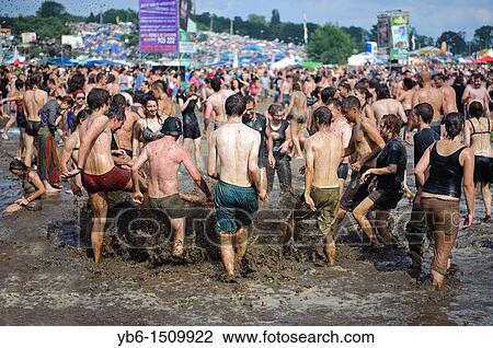 Young people having fun in the mud at the Przystanek Woodstock - Europe's largest open air festival in Kostrzyn, Poland View Large Photo Image Stock Image - Young people having fun in the mud at the Przystanek Woodstock - Europe's largest open air festival in Kostrzyn, Poland. Fotosearch
