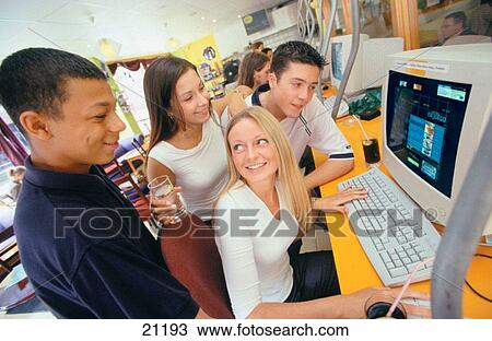 Young people in Internet cafe View Large Photo Image Stock Image - Young people in Internet cafe. Fotosearch