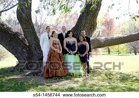 Young people in prom clothes at the park. View Large Photo Image Picture - Young people in prom clothes at the park.. Fotosearch