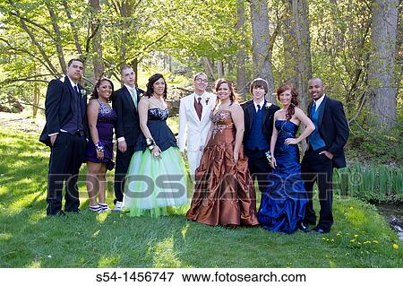 Young people in prom clothes at the park. View Large Photo Image Stock Photo - Young people in prom clothes at the park.. Fotosearch
