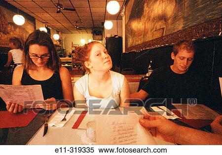 Young people in restaurant View Large Photo Image Stock Photography - Young people in restaurant. Fotosearch