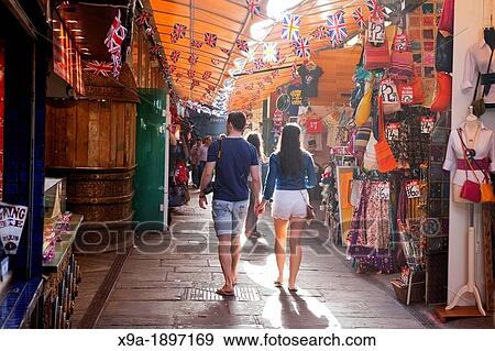 Young People Shopping at Stables Market, Camden Lock, Camden, London, England, UK View Large Photo Image Stock Photo - Young People Shopping at Stables Market, Camden Lock, Camden, London, England, UK. Fotosearch