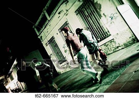 Young people strolling in the night View Large Photo Image Stock Photo - Young people strolling in the night. Fotosearch