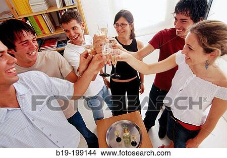 Young people, toasting View Large Photo Image Picture - Young people, toasting. Fotosearch