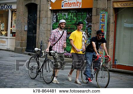 Stock Image - Young people walking in the street Rennes, Brittany, France. Fotosearch