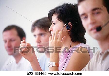 Stock Photo - Young people with headsets. Fotosearch