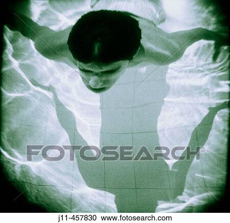 Young person diving in swimming-pool. View Large Photo Image Stock Image - Young person diving in swimming-pool.. Fotosearch