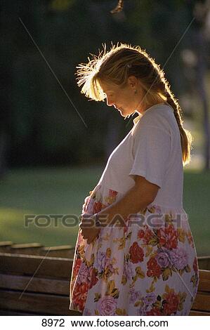 Young pregnant mother anticipating motherhood View Large Photo Image Stock Image - Young pregnant mother anticipating motherhood. Fotosearch