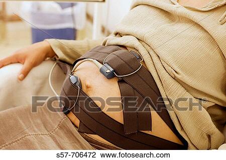 Young pregnant woman examined by monitoring device View Large Photo Image Stock Image - Young pregnant woman examined by monitoring device. Fotosearch