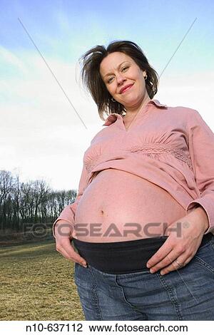 Stock Image - Young pregnant woman.. Fotosearch