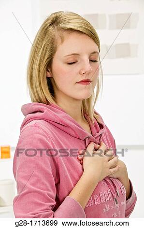 young pretty woman out of breath suffering from asthma View Large Photo Image Stock Photo - young pretty woman out of breath suffering from asthma. Fotosearch