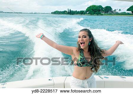Young Quinceaera enjoying a cruising along the coast of Miami, Florida, USA View Large Photo Image Stock Photo - Young Quinceaera enjoying a cruising along the coast of Miami, Florida, USA. Fotosearch