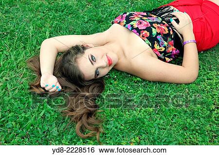Young Quinceaera posing lying on south park about Miami Beach, Florida, USA View Large Photo Image Stock Photograph - Young Quinceaera posing lying on south park about Miami Beach, Florida, USA. Fotosearch