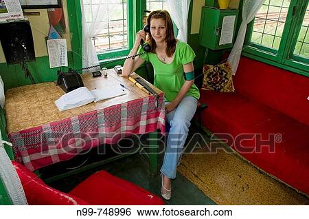 Young signalwoman in her cottage, calling on an old telephon set, railway station of Guljanci, Danube valley, Northern Bulgaria View Large Photo Image Stock Photograph - Young signalwoman in her cottage, calling on an old telephon set, railway station of Guljanci, Danube valley, Northern Bulgaria. Fotosearch