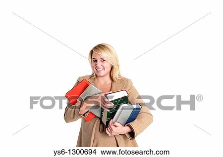 Young smiling blonde woman in business suit holding books View Large Photo Image Picture - Young smiling blonde woman in business suit holding books. Fotosearch
